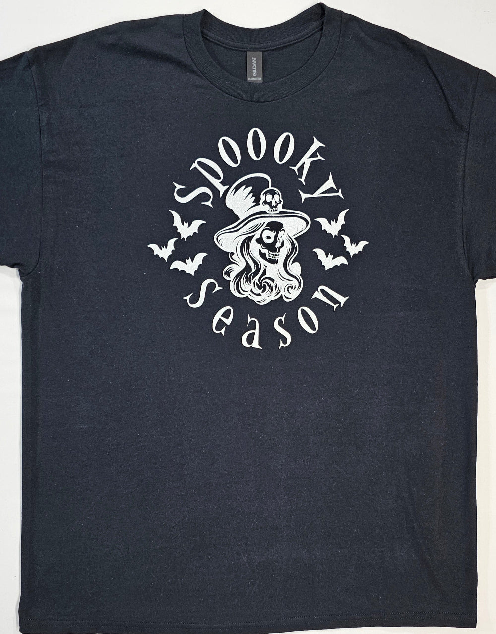 Black t-shirt with 'Spookly Season' graphic design featuring a witch and bats on a white background.
