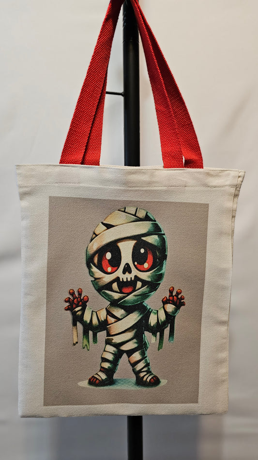 Decorative pillow with a cartoonish mummy design on a neutral background