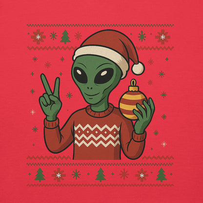 Alien wearing a Santa hat and holding a Christmas ornament on a red background with holiday patterns.