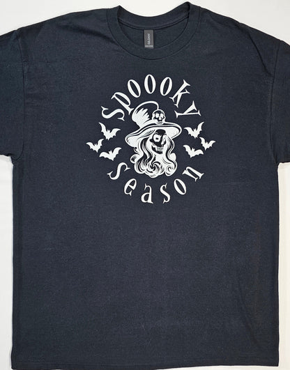 Black t-shirt with 'Spookly Season' graphic design featuring a witch and bats on a white background.