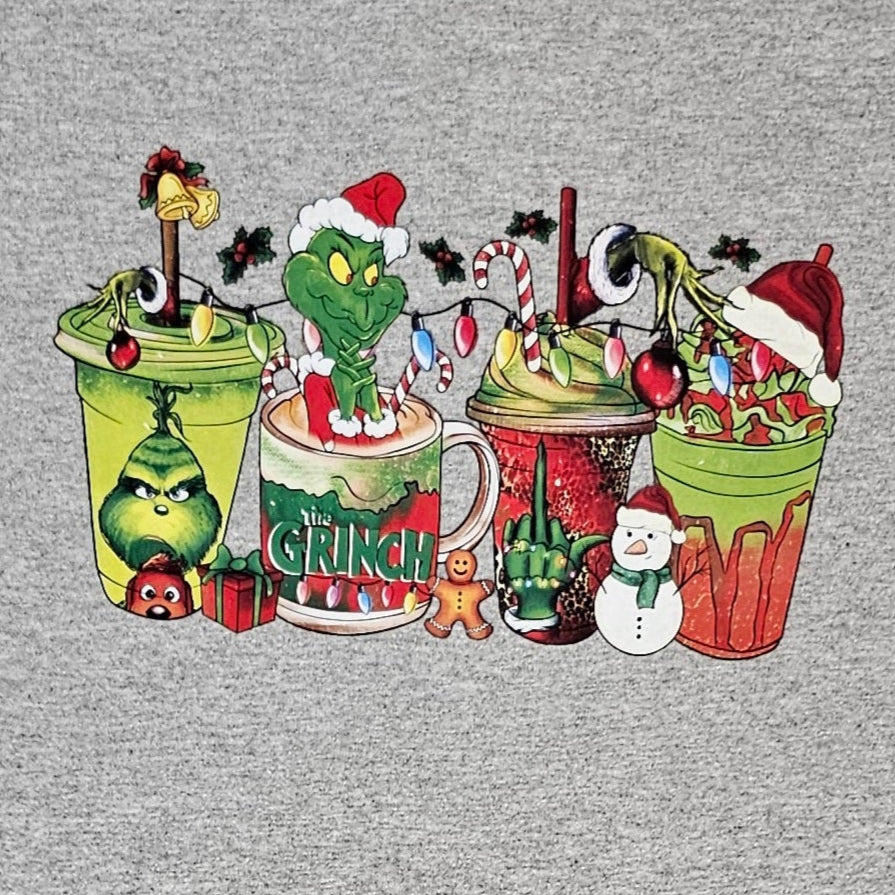 Gray t-shirt with Christmas-themed design featuring cups and characters on a white background