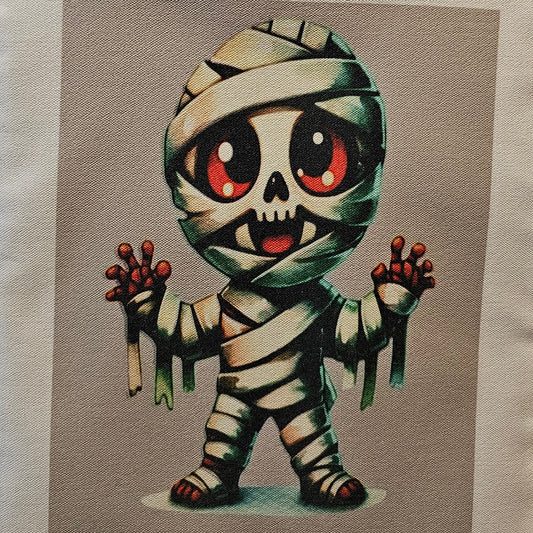 Decorative tote with a cartoonish mummy design on a neutral background
