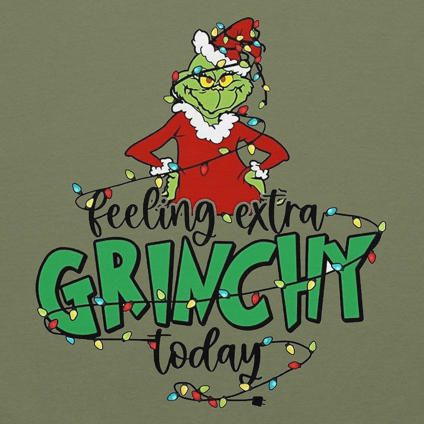 Grinch character with 'Feeling extra Grinchy today' text on a green background