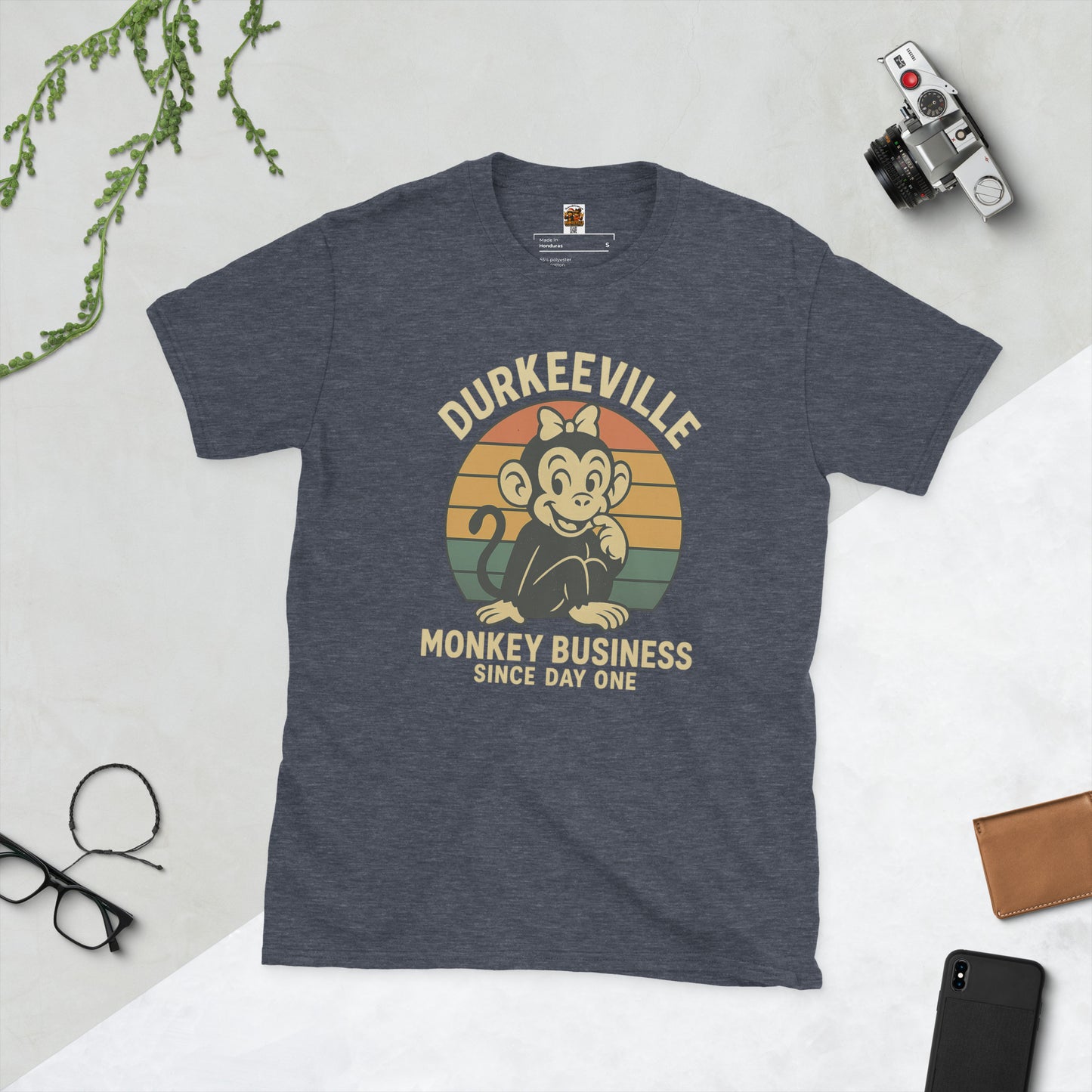 Gray t-shirt with 'Durkeeville Monkey Business Since Day One' graphic on a light gray background