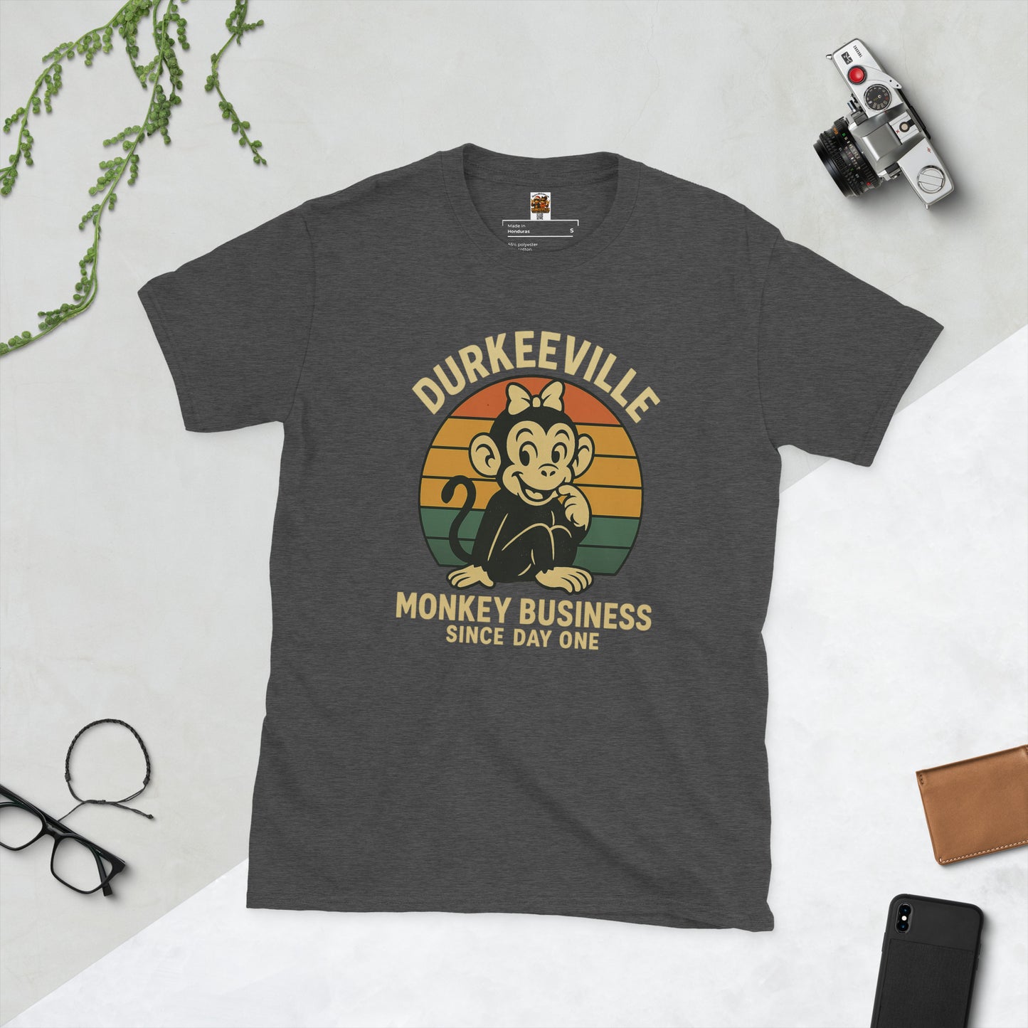 Gray t-shirt with 'Durkeeville Monkey Business Since Day One' graphic on a light gray background