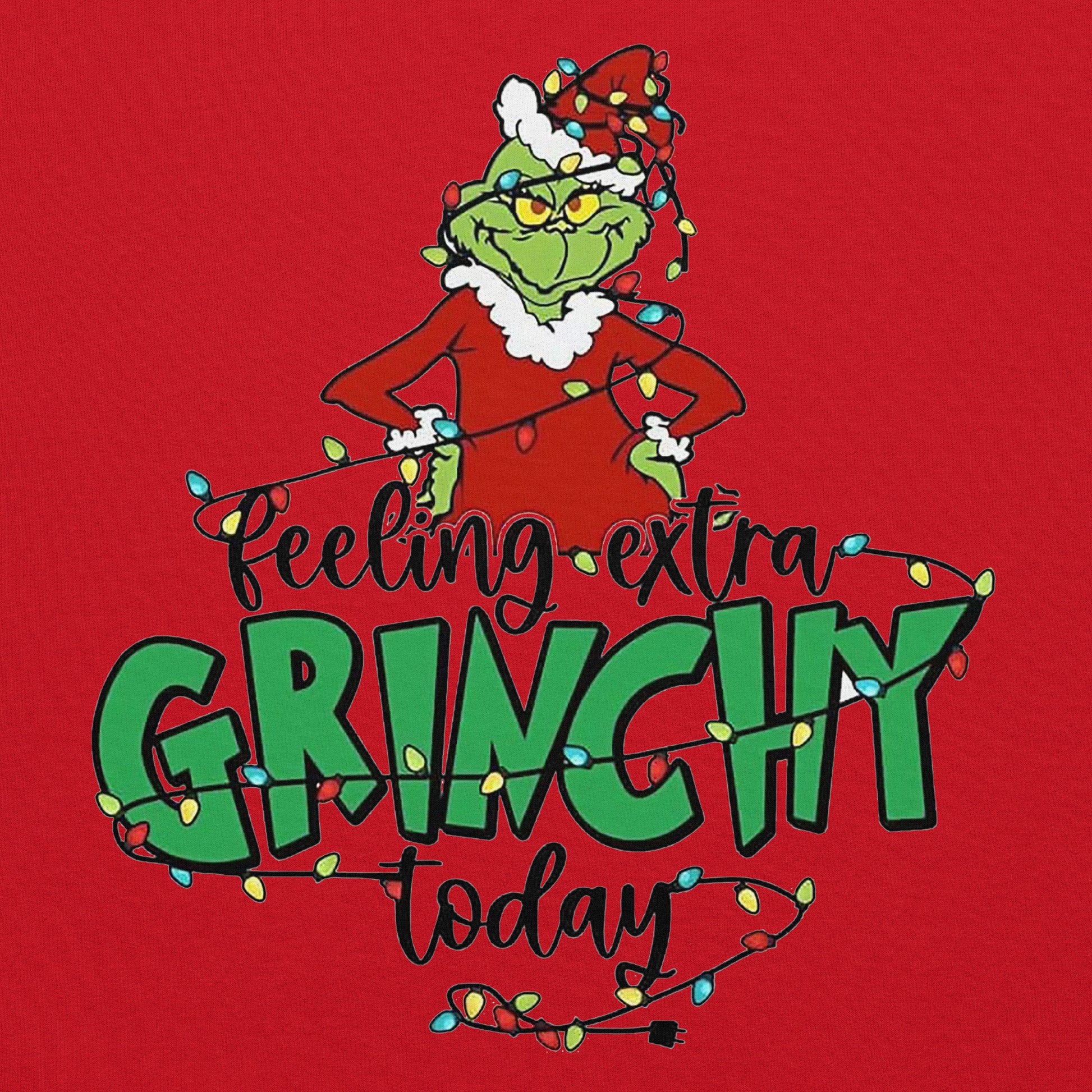 Grinch graphic with 'Feeling extra Grinchy today' text on a red background