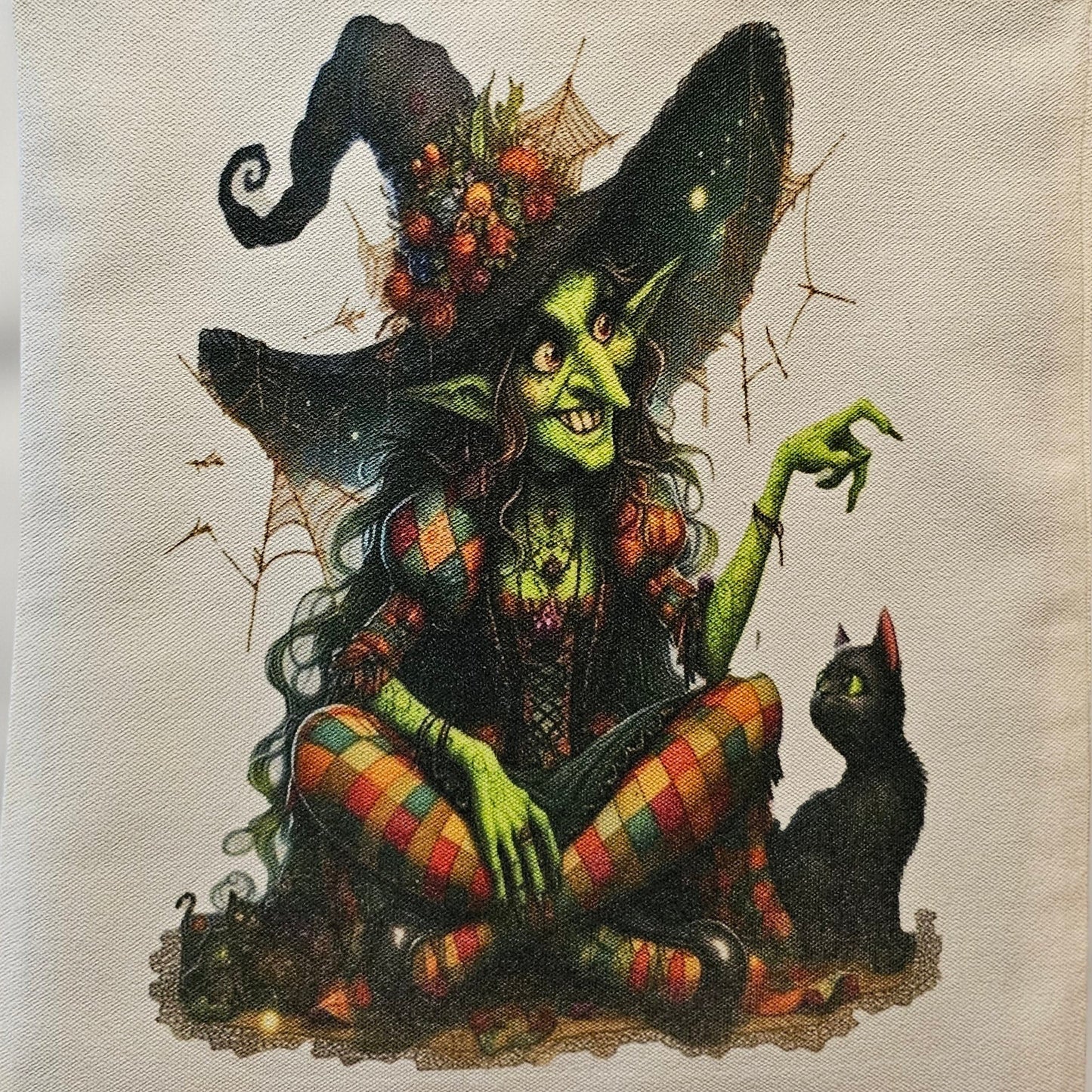 Tote bag with a fantasy design featuring a creature and flowers on a plain background