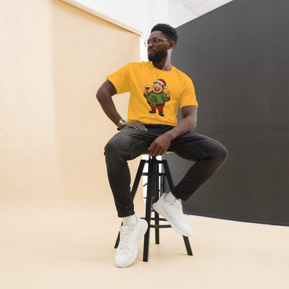 Man sitting on a stool wearing a yellow t-shirt with a graphic design, against a plain background.
