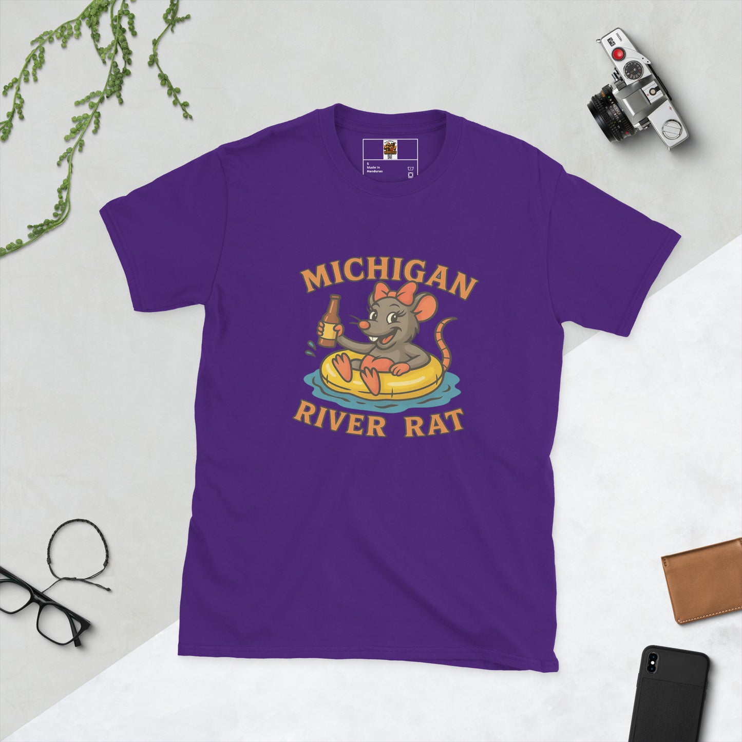 Purple t-shirt with 'Michigan River Rat' graphic on a light gray background