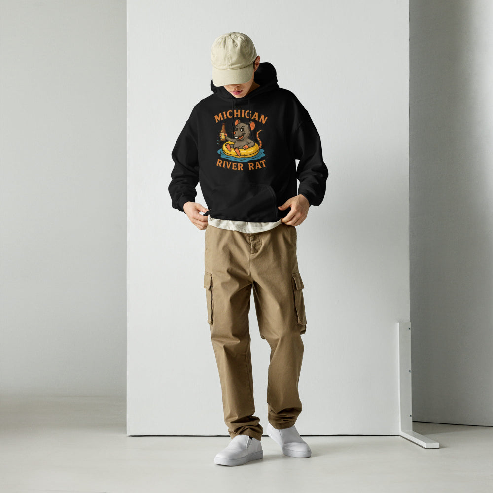 Person wearing a black hoodie with a graphic design and brown cargo pants on a white background