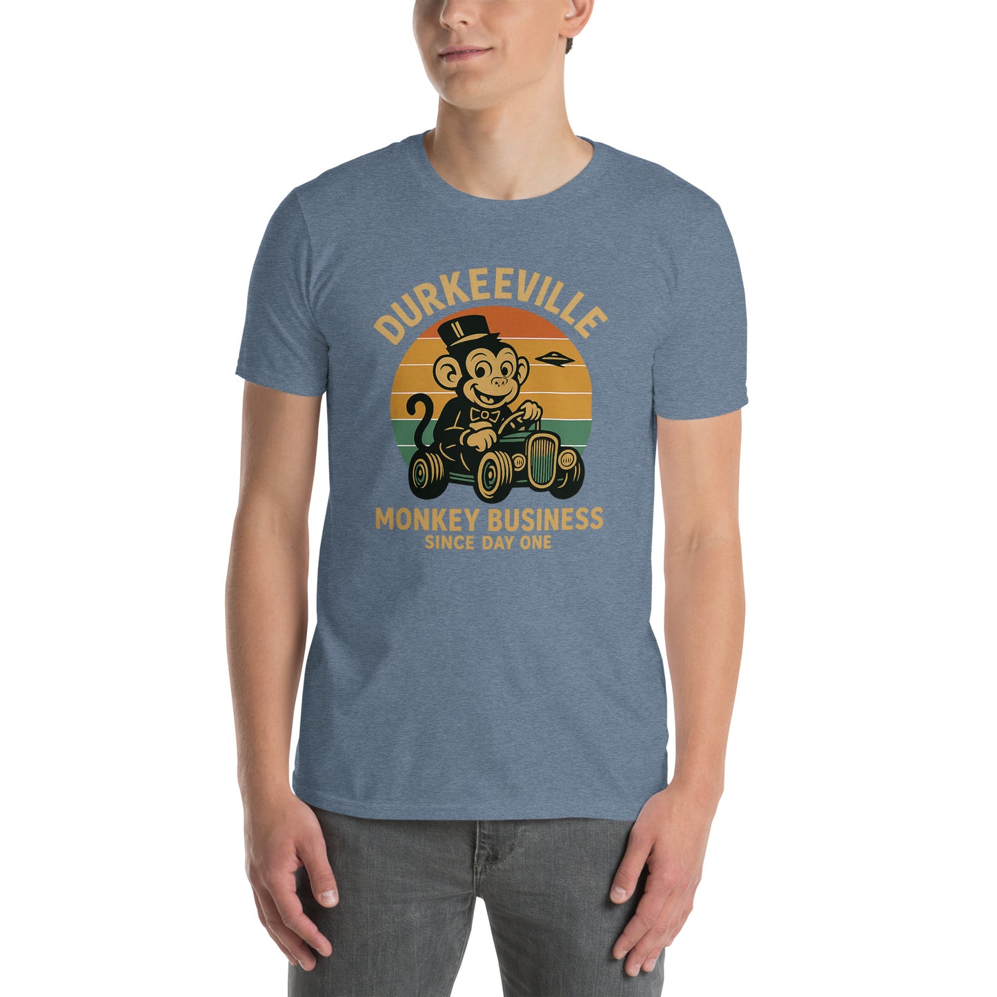 Person wearing a blue t-shirt with a graphic design of a monkey and text on a white background