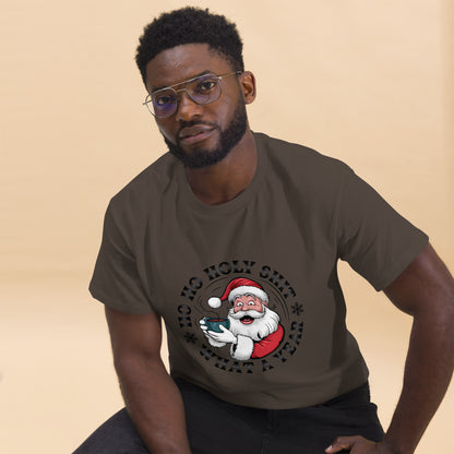 Man wearing a brown t-shirt with a graphic design of Santa Claus holding a mug on a beige background