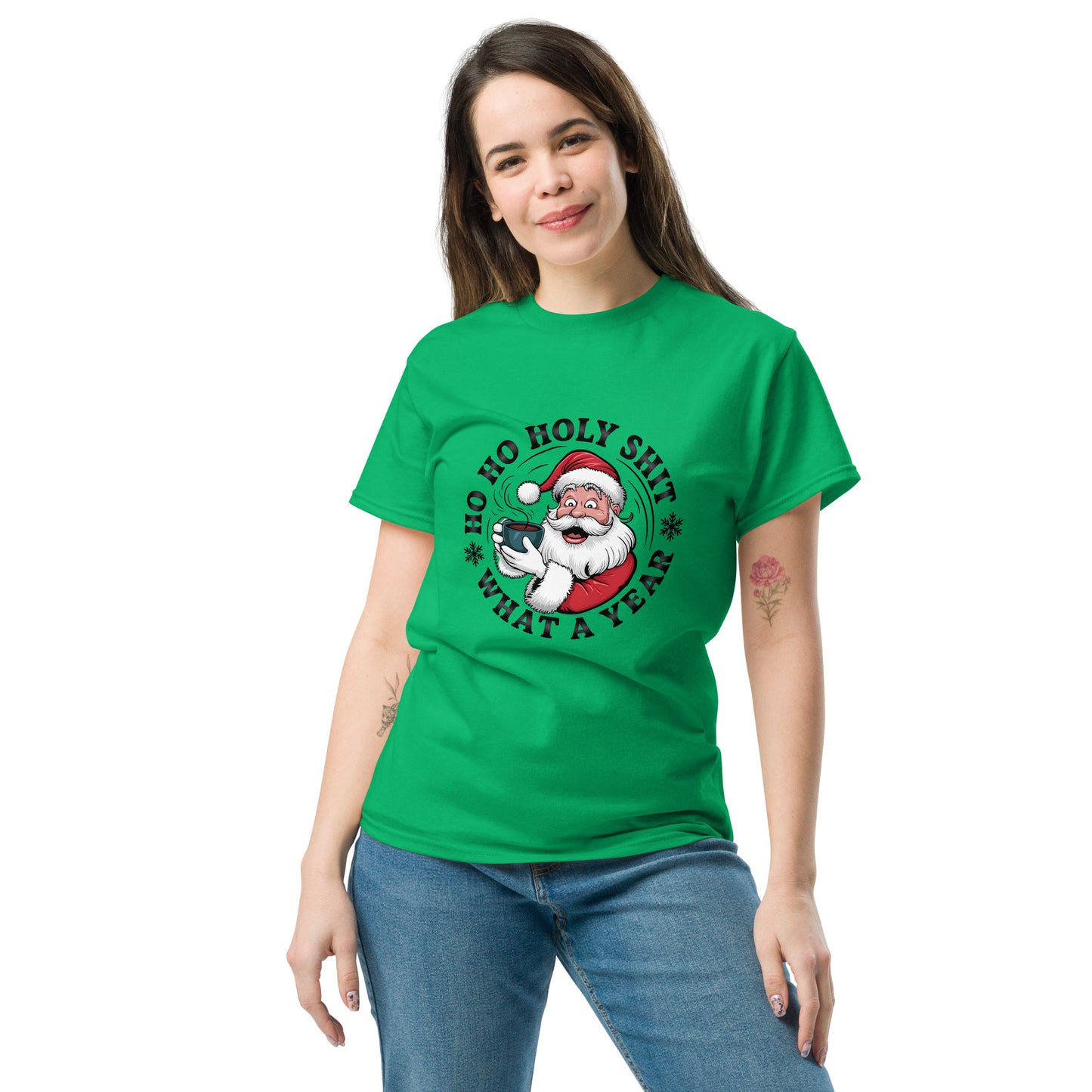 Person wearing a green t-shirt with a Christmas-themed graphic and text.