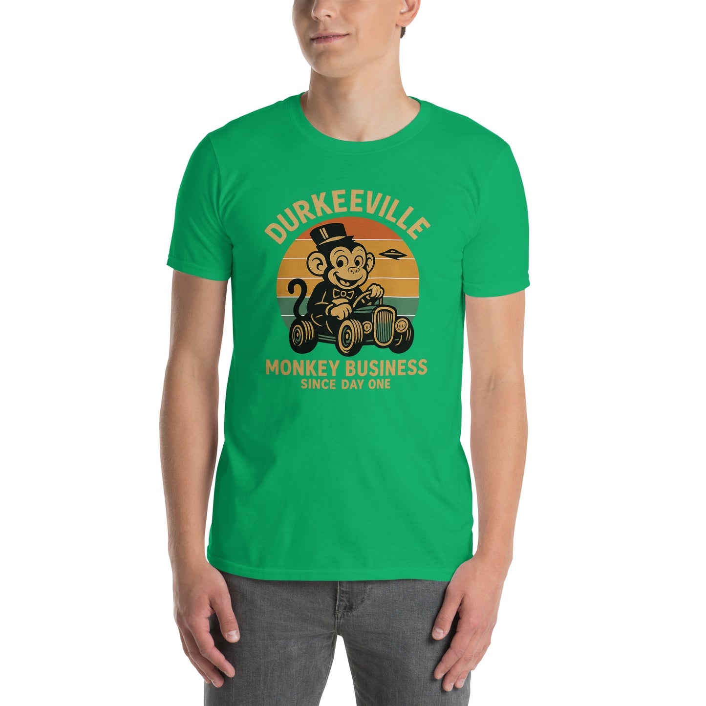 Person wearing a green t-shirt with a monkey graphic and text on a white background