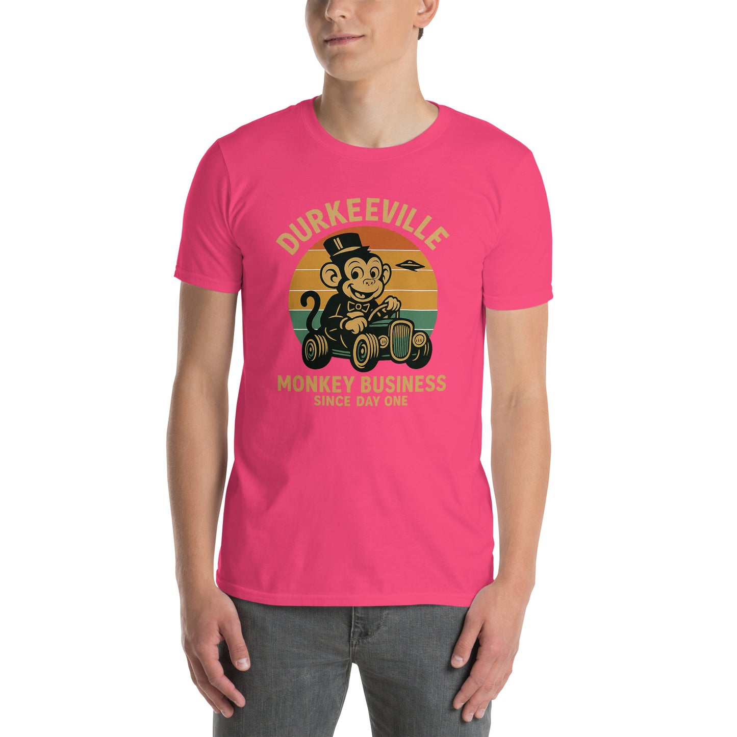 Person wearing a pink t-shirt with a graphic design and text on a white background