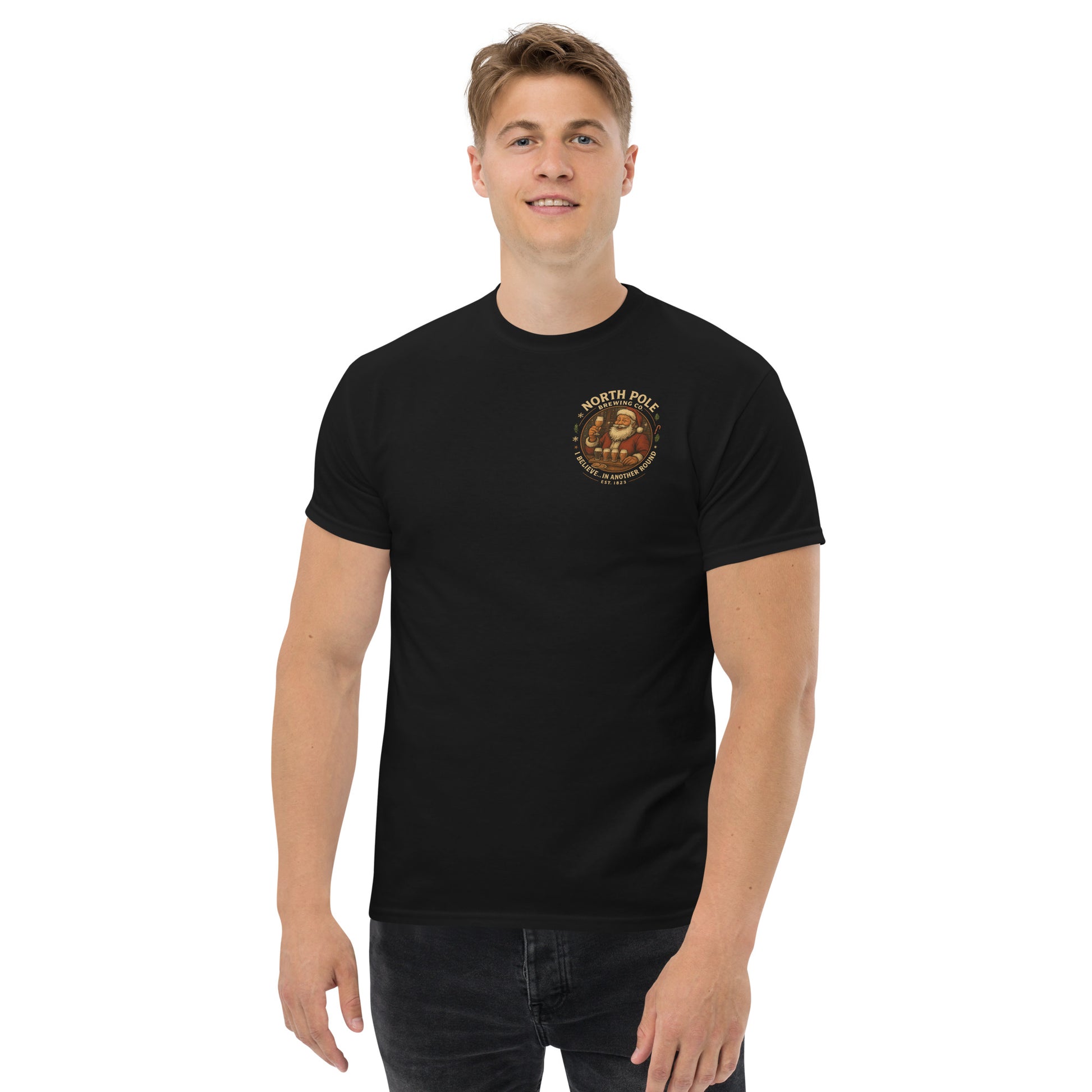 Man wearing a black t-shirt with a logo on a white background