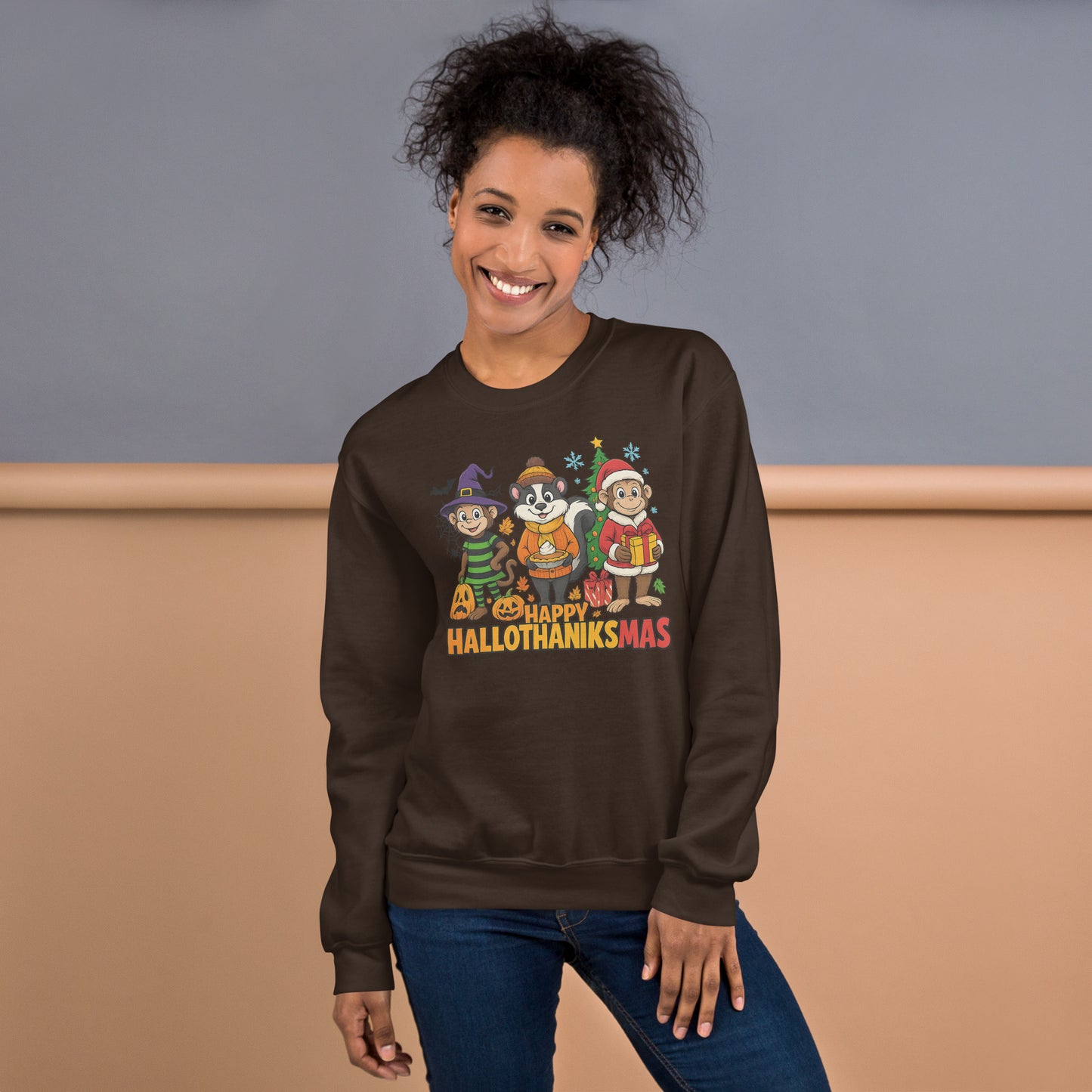 Person wearing a brown sweatshirt with 'Happy Hallothanksmas' design against a beige and gray background