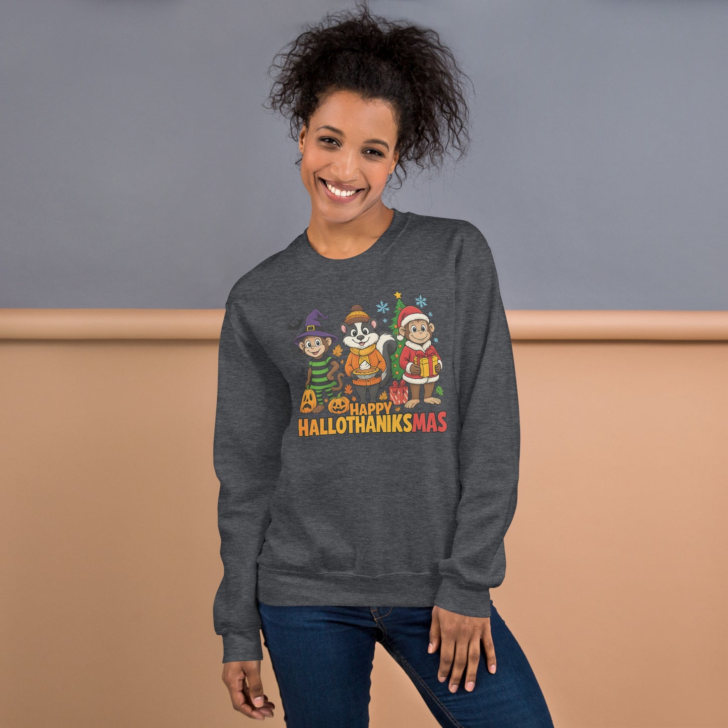 Person wearing a dark gray sweatshirt with 'Happy Hallothanksmas' design against a beige and gray background