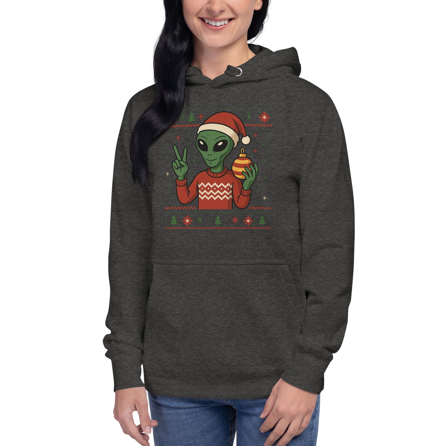 Person wearing a dark gray hoodie with a Christmas-themed alien design on a white background