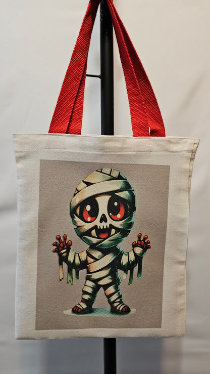 Decorative pillow with a cartoonish mummy design on a neutral background