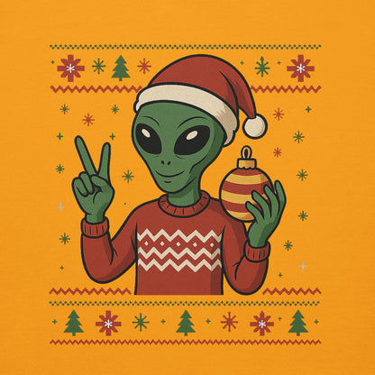 Alien wearing a Santa hat and holding a Christmas ornament on an orange background with festive patterns.