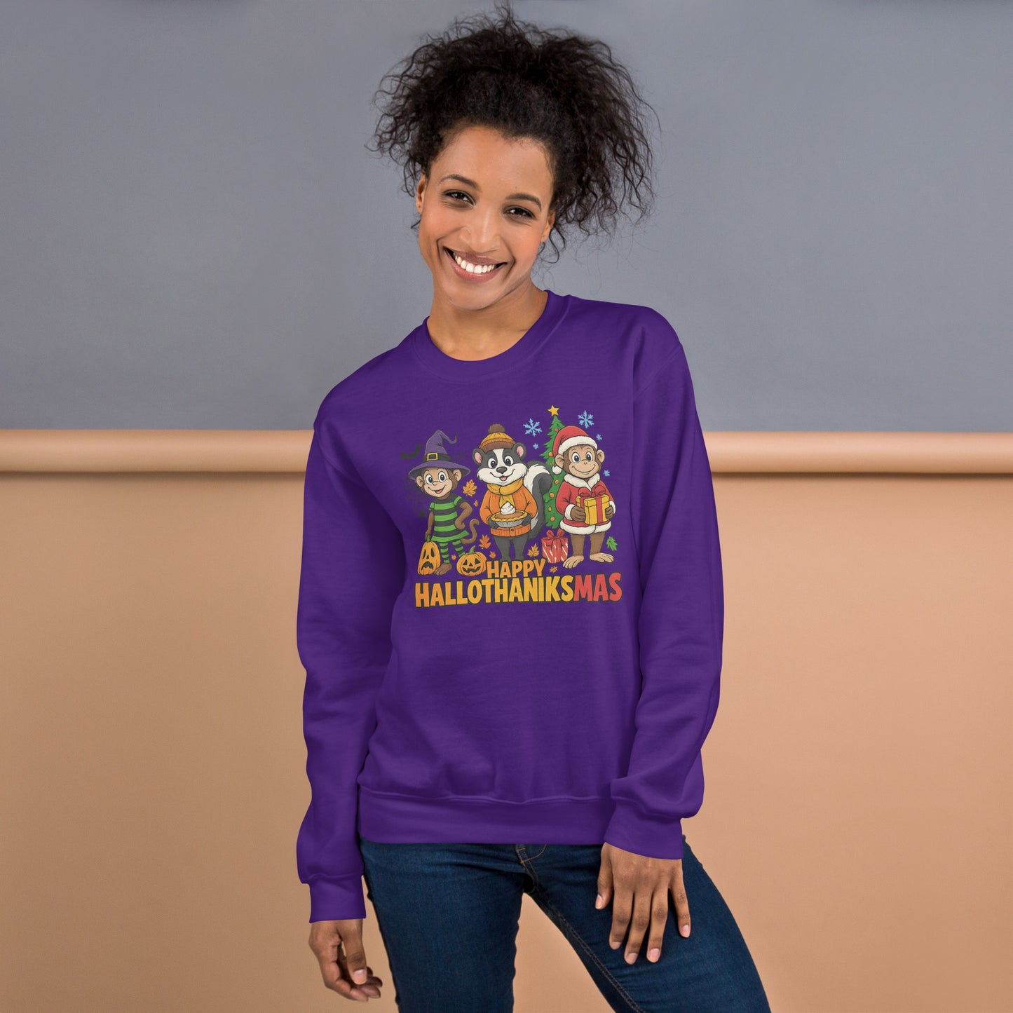 Person wearing a purple sweatshirt with 'Happy Hallothanksmas' design against a plain background