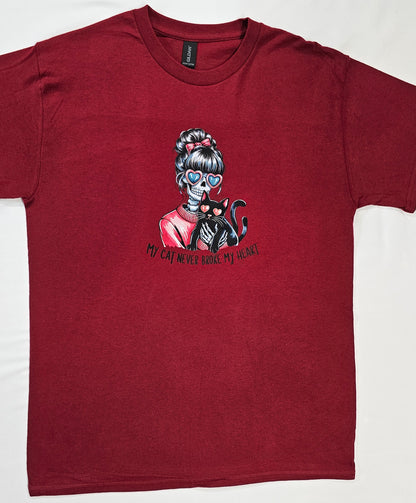 Maroon t-shirt with a graphic of a skeleton holding a cat and text on a white background
