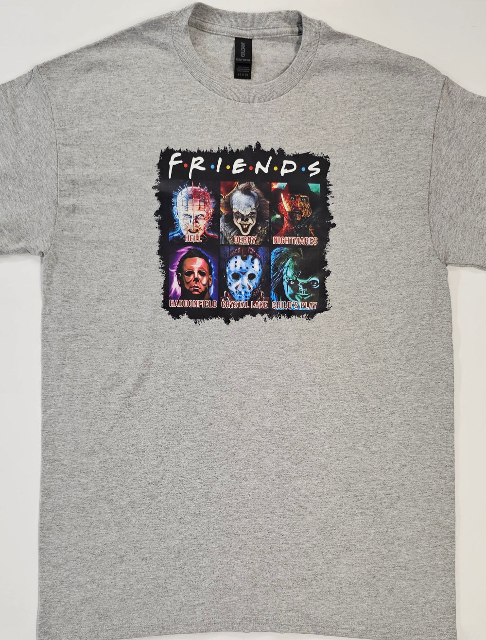 Gray t-shirt with 'Friends' graphic design featuring character faces.
