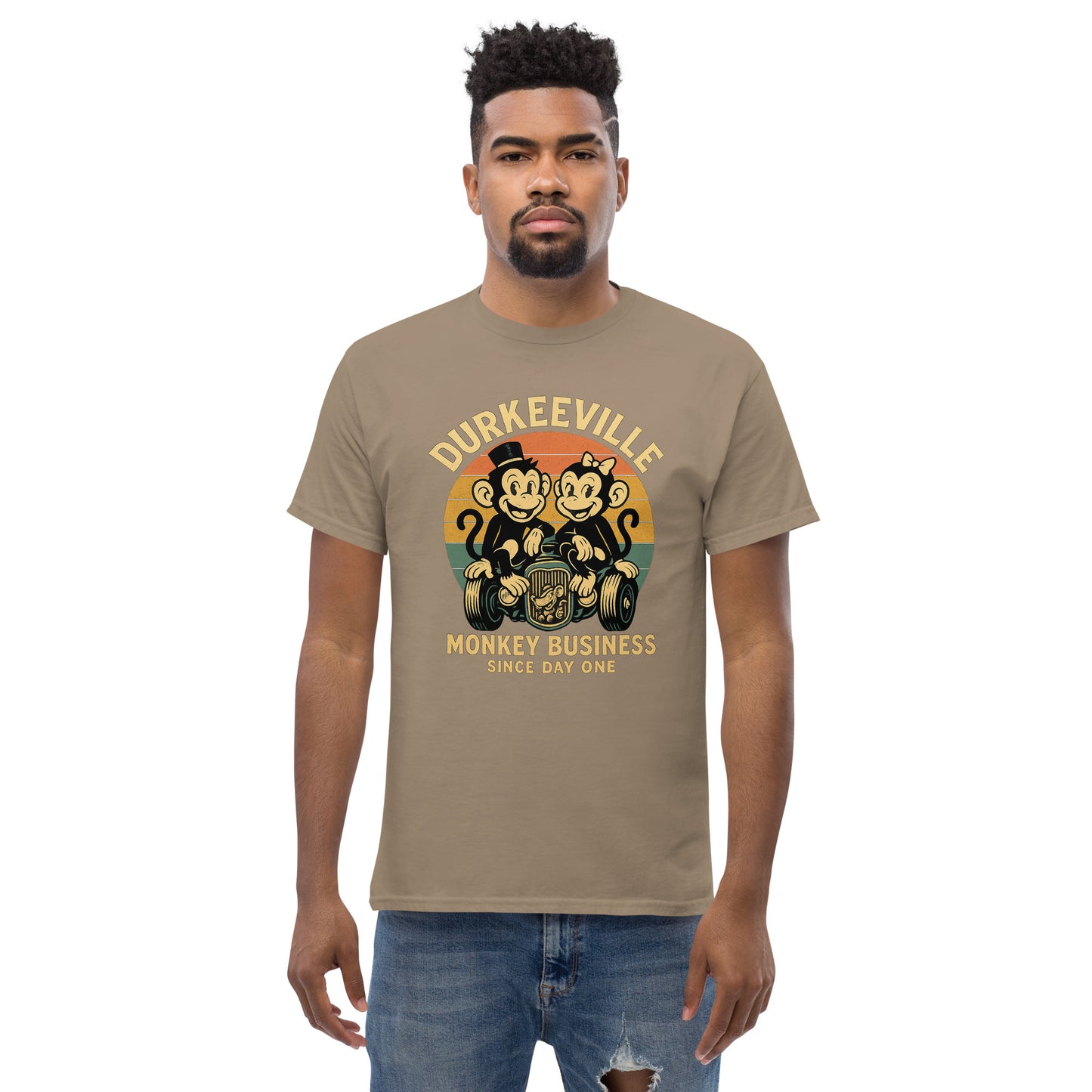 tan  t-shirt with 'Durkeeville Monkey Business Since Day One' graphic on a white background