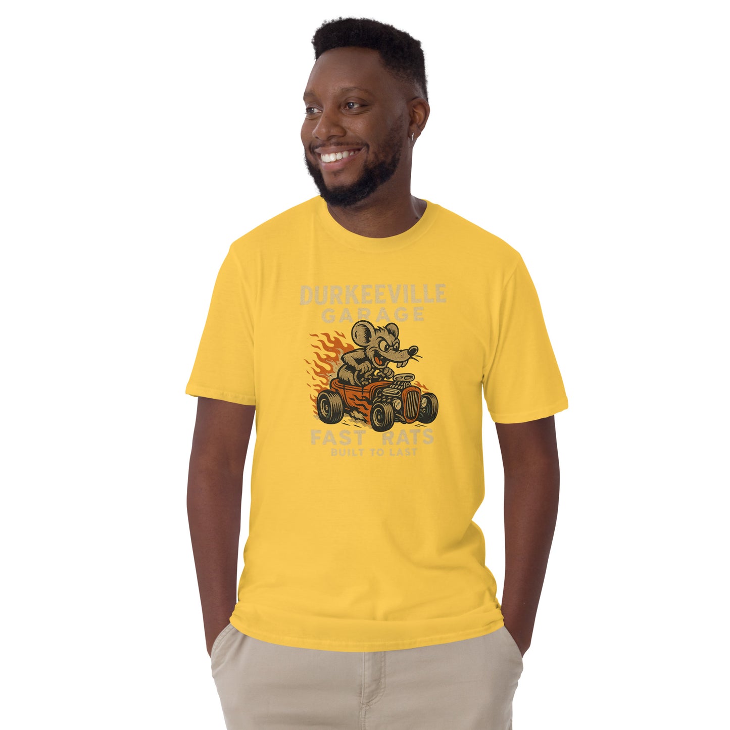 Man wearing a yellow t-shirt with a graphic design on a white background